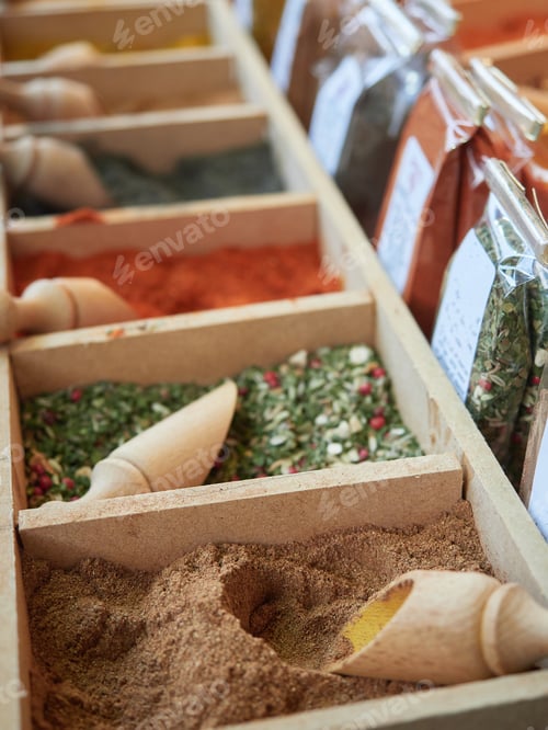Preview: Close-up of various spices and culinary seasonings for sale.