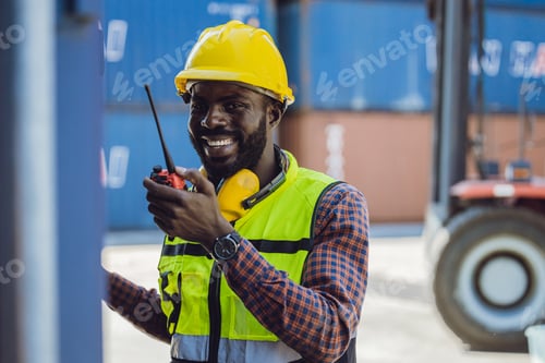 Preview: happy worker working in port logistic cargo industry with radio command