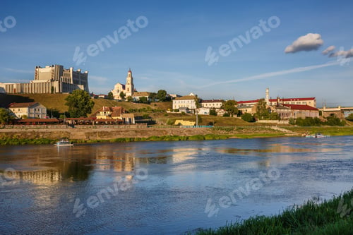 Preview: panorama of evening in the old town on the bank of a wide river