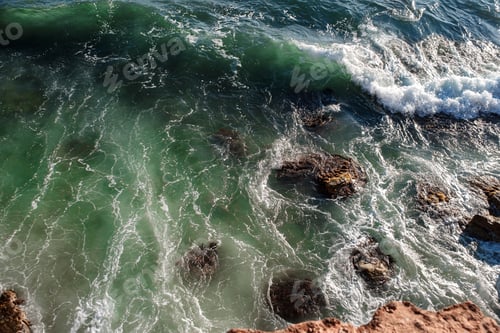 Preview: Ocean wave background breaking sea water rocky shore
