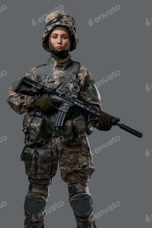 Preview: Proud woman with rifle posing against gray background