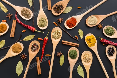 Preview: Various spices in wooden spoons.