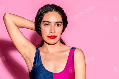 Preview: Cheerful woman wearing a colorful swimsuit