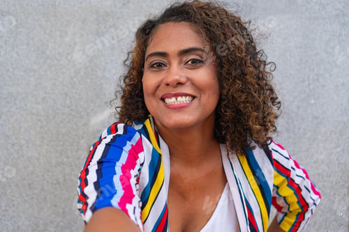 Preview: Cheerful portrait African American woman taking selfie outdoors