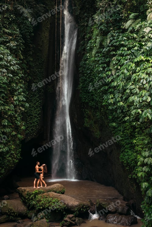 Preview: A couple in love on a waterfall. Honeymoon trip. Happy couple on the island of Bali