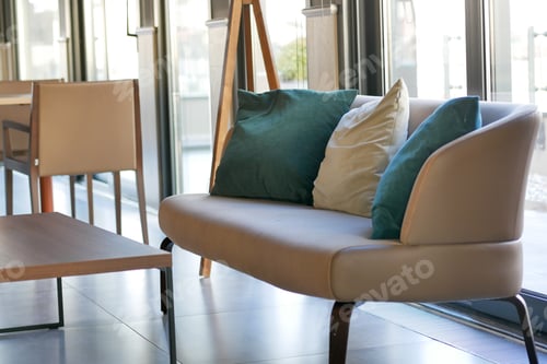 Preview: modern grey sofa with pillows in living room at home