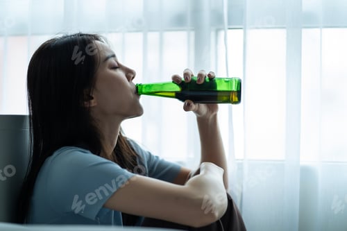 Preview: Asian young depression woman feeling heart broken and drinking beer.