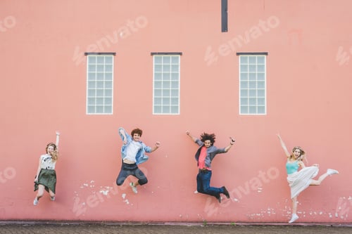 Preview: Friends jumping against pink wall background