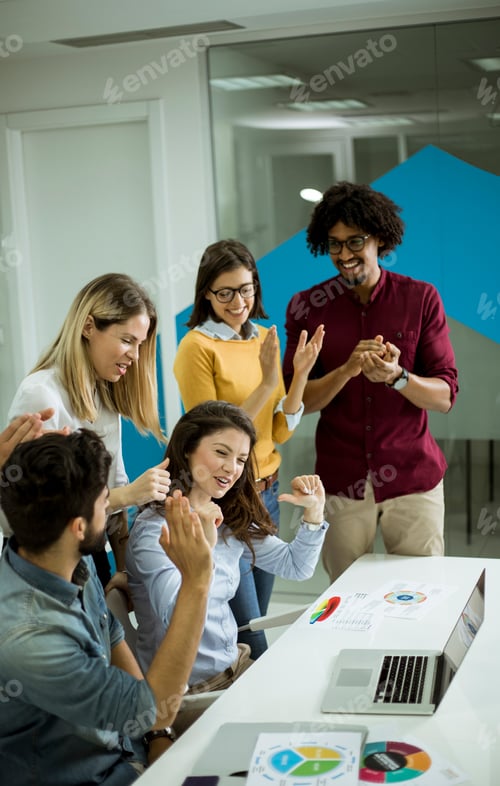 Preview: Successful young businesspeople having meeting in modern office
