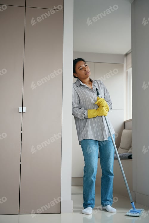 Preview: Upset and tired african american female leaned against the closet