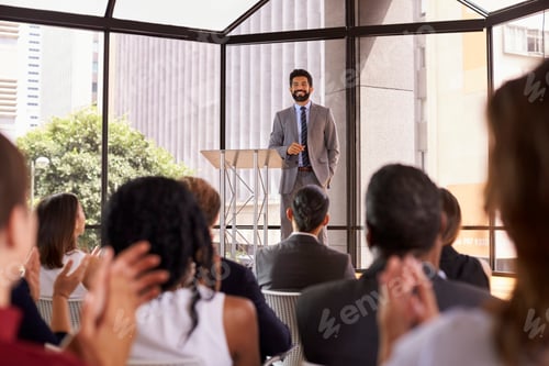 Preview: Audience applauding speaker at a business seminar