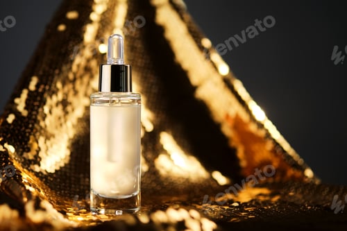 Preview: A bottle of cosmetic serum with a pipette on a festive golden background.