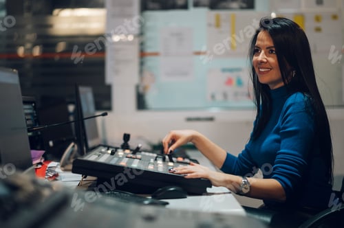 Preview: Middle aged woman using equipment in control room on a tv station