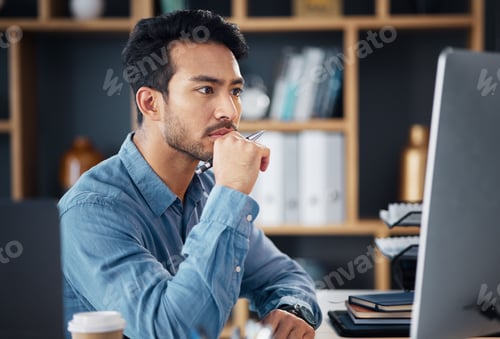 Preview: Serious, business man and thinking on computer at desk, internet research and analysis. Focused mal