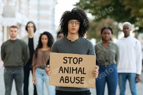 Preview: Black guy holding placard stop animal abuse