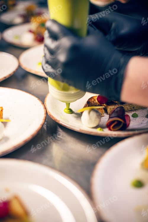Preview: Chef finishing his plate