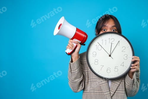 Preview: Businesswoman Peeking On Clock While Holding Megaphone