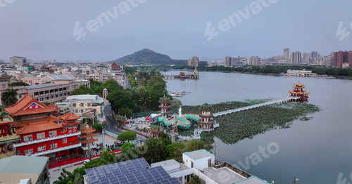 Preview: Aerial view of the tranquil Love River in Kaohsiung with scenic landmarks and lush surroundings