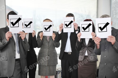 Preview: Successful Team Holding Check Mark Vote Sign