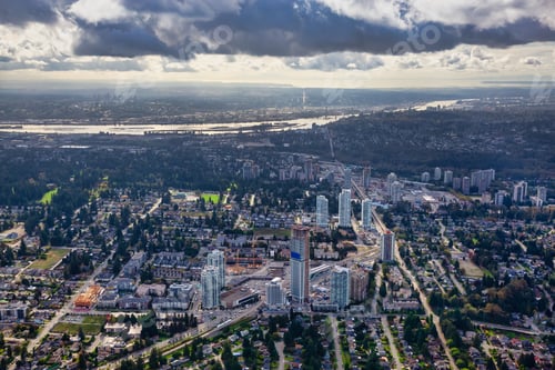 Preview: Aerial view of a modern cityscape during a sunny summer morning