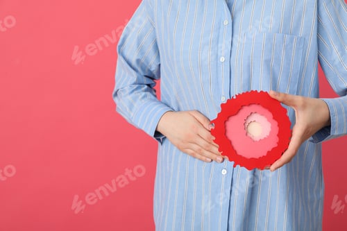 Preview: Abdominal Health Concept, Woman Holding Decorative Object