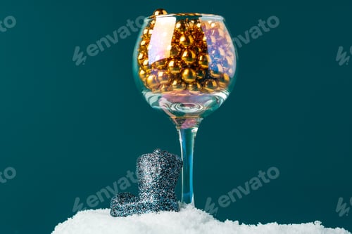 Preview: Little christmas baubles in wineglasses on a dark background