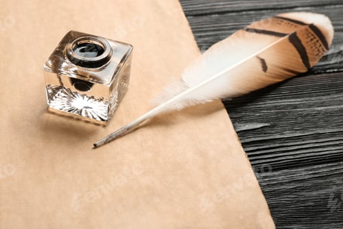 Preview: Feather pen, inkwell and blank parchment on wooden table
