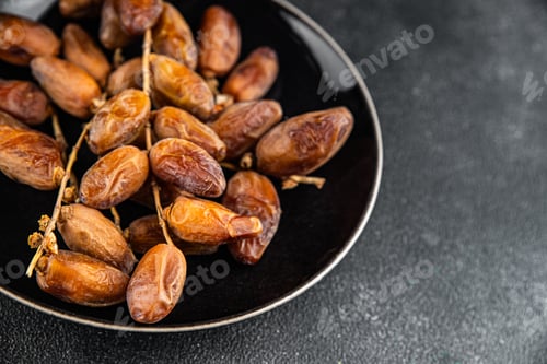 Preview: date on a branch dried sweet fruit fresh meal food snack on the table copy space food background