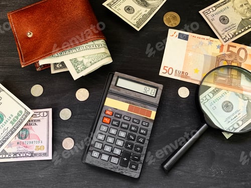 Preview: Calculator, cash money and wallet on black wooden background