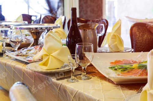 Preview: Served for a banquet catering table with wine glasses and plates for food