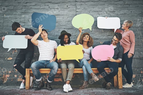 Preview: Shot of a diverse group of people holding up speech bubbles outside