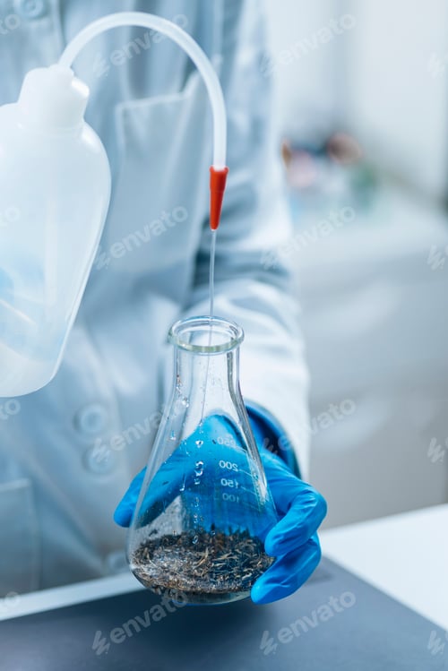 Preview: Pesticides in Tea. Quality Control Inspector Working with Herbal Tea Sample in Laboratory