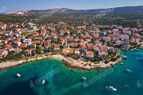 Preview: Aerial view of Adriatic sea coastline with coastal village along shoreline