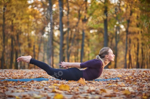 Preview: Beautiful young woman practices yoga