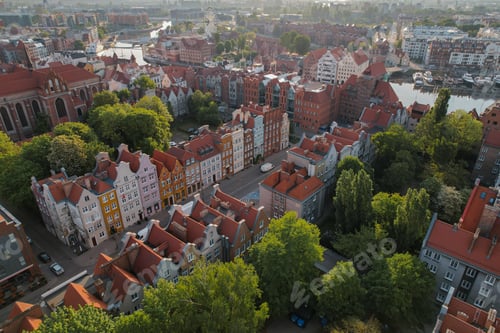 Preview: Beautiful panoramic architecture of old town in Gdansk, Poland at sunrise. Aerial view drone pov