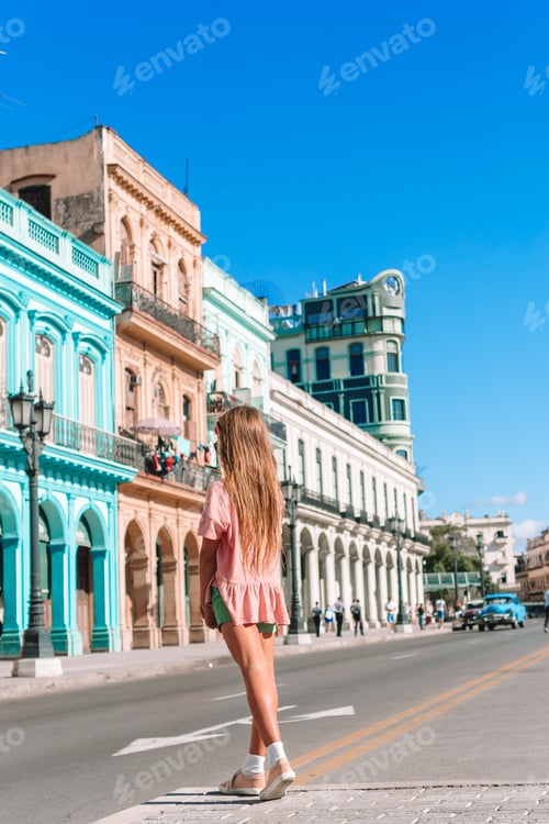 Preview: Tourist girls in popular area in Havana, Cuba. Young woman traveler smiling