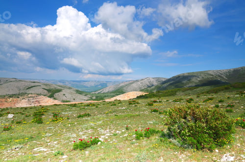 Preview: Mountain landscape and small village in distance