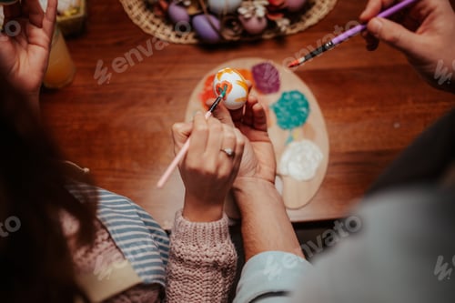 Preview: Hands creating colorful easter egg art
