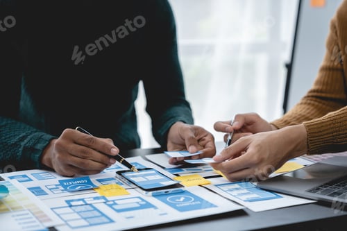 Preview: ux developers, UI designers Asian group data researchers brainstorm on tabletop mobile app interface
