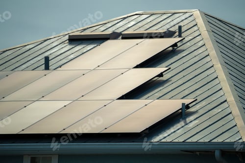 Preview: Aerial view of typical american building roof with blue solar photovoltaic panels