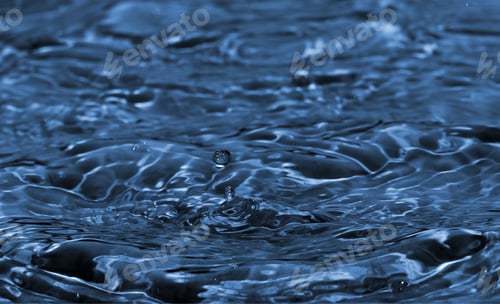 Preview: Raindrop Splashes - Close Up Photograph Of Raindrop Splashes In A Clay Bird Bath. Blue Filter Added