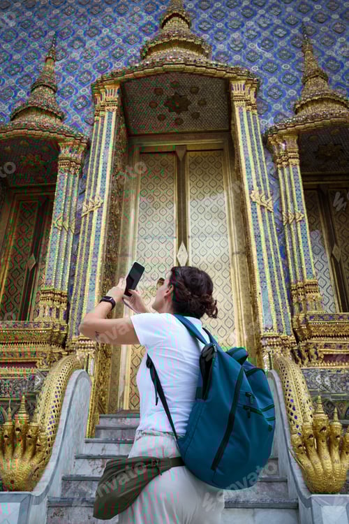 Preview: Tourist taking pictures of the grand palace in bangkok, thailand