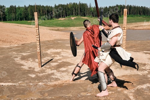 Preview: A Concept Photo Of A Roman Battle Of Two Warriors Of The Colosseum In Action With Aggressive