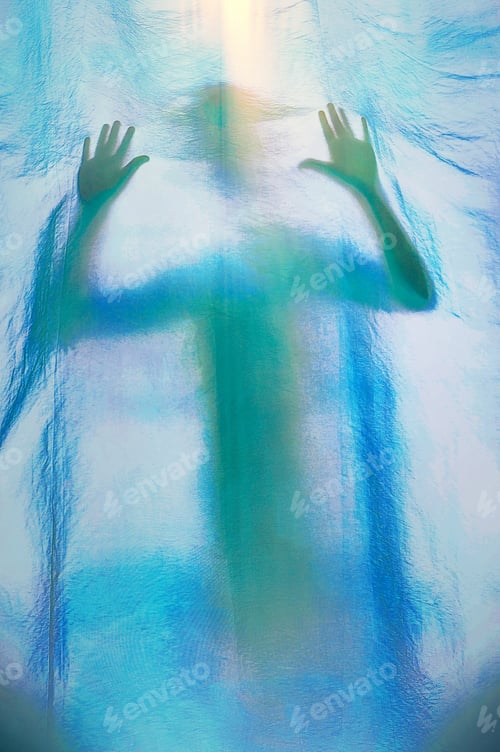 Preview: abstract shadow silhouette of a person through fabric