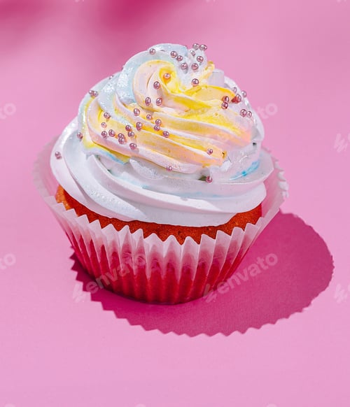 Preview: Colorful cupcake on pink background