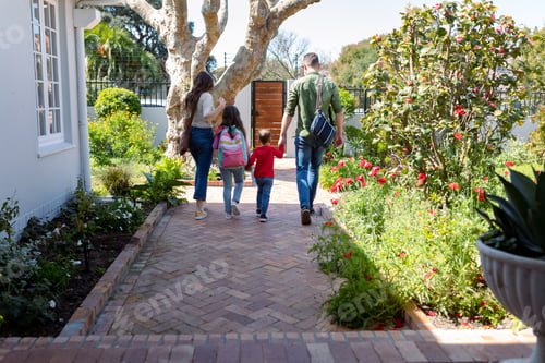 Preview: Back view of caucasian family heading to school and work