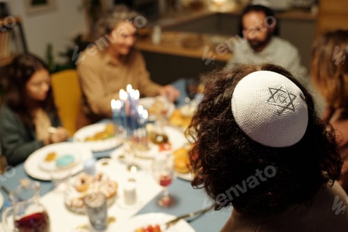 Preview: White yarmulke with silver star of David on head of young Jewish man