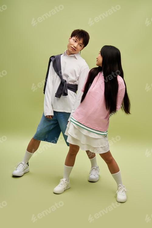 Preview: Stylish couple showcases love and playful connection in a vibrant setting filled with joy