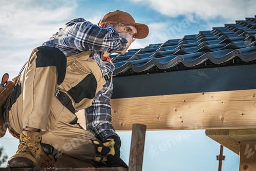 Preview: Roof Contractor Talking On Cell Phone.