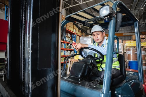 Preview: Warehouse worker working with a forklift in a warehouse or storehouse.